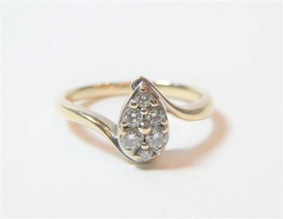 Lot 154 - An 18 carat white gold pear shaped diamond cluster ring, total estimated diamond weight 0.25...