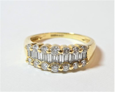 Lot 178 - An 18 carat gold diamond three row ring, total estimated diamond weight 0.75 carat...