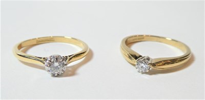 Lot 181 - A 9 carat gold diamond solitaire ring, finger size P and another diamond solitaire ring,...