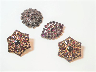 Lot 187 - Two garnet brooches and a pair of earrings, a lozenge shaped cluster brooch of foil backed garnets