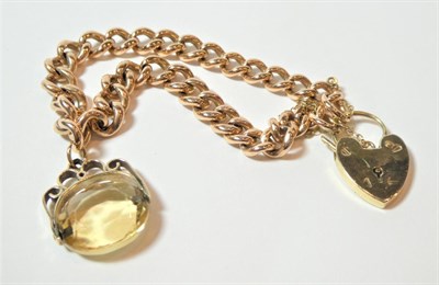 Lot 188 - A curb link bracelet, each link stamped '9' '.375', with a 9 carat gold padlock clasp and a...