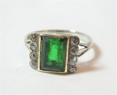 Lot 193 - A green stone and diamond ring, finger size N1/2