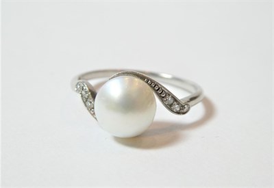 Lot 196 - A cultured pearl and diamond ring, the central cultured pearl to asymmetric old cut diamond set...