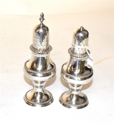 Lot 205 - A Georgian style silver baluster salt and pepperette, LRW, London 1981 (2)