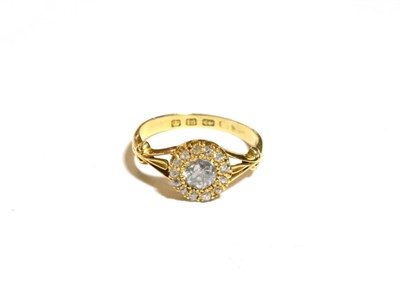 Lot 221 - An 18 carat gold diamond cluster ring, the central old cut diamond within a border of thirteen...