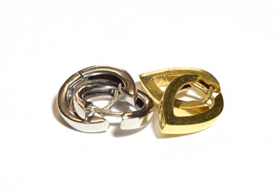 Lot 222 - A pair of 18 carat gold pointed earrings; and a pair of 9 carat white gold cuff earrings (2)