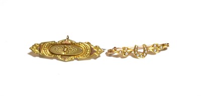 Lot 223 - A bar brooch, stamped '9C', length 3.8cm; and a seed pearl set bar brooch, length 3.2cm (2)