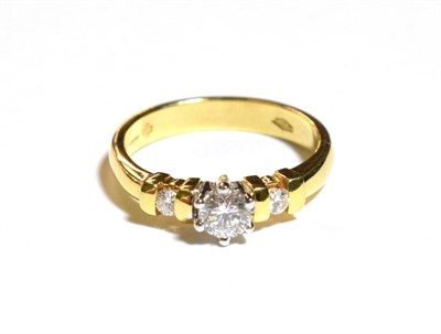 Lot 225 - An 18 carat gold diamond solitaire ring, a round brilliant cut diamond in a claw setting, to...