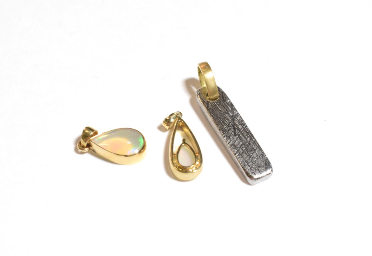 Lot 234 - A 9 carat gold opal pendant, length 2.4cm; an opal pendant, unmarked, length 2cm; and another...