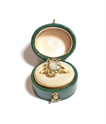 Lot 241 - An 18 carat gold opal ring, finger size O1/2