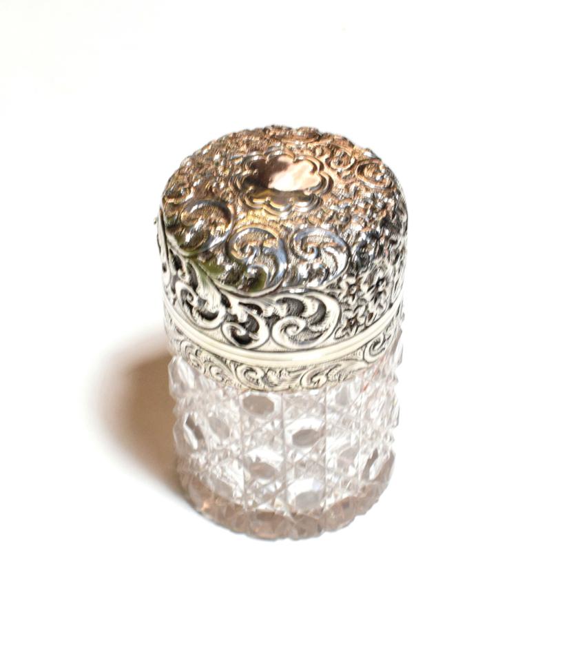 Lot 249 - A Victorian silver-mounted cut-glass scent-bottle, the silver mounts by Henry Titterton...