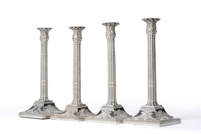 Lot 549 - A Set of Four George III Candlesticks, John Carter, London 1771, the square bases rising to cluster