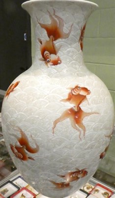 Lot 277 - A Chinese porcelain carved vase, decorated with fish