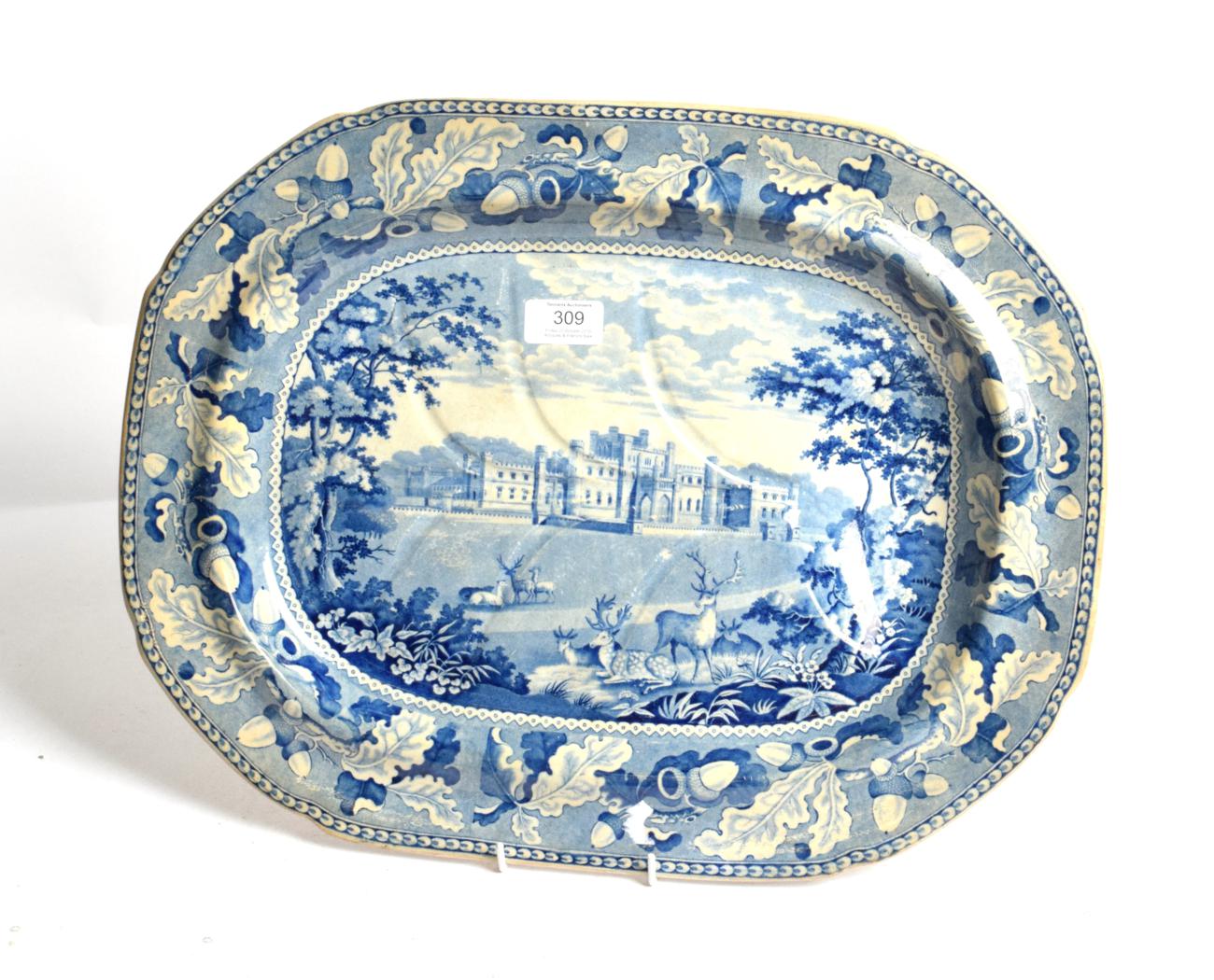 Lot 309 - A Staffordshire pearl ware meat platter, circa 1820, printed in underglaze blue with Lowther Castle