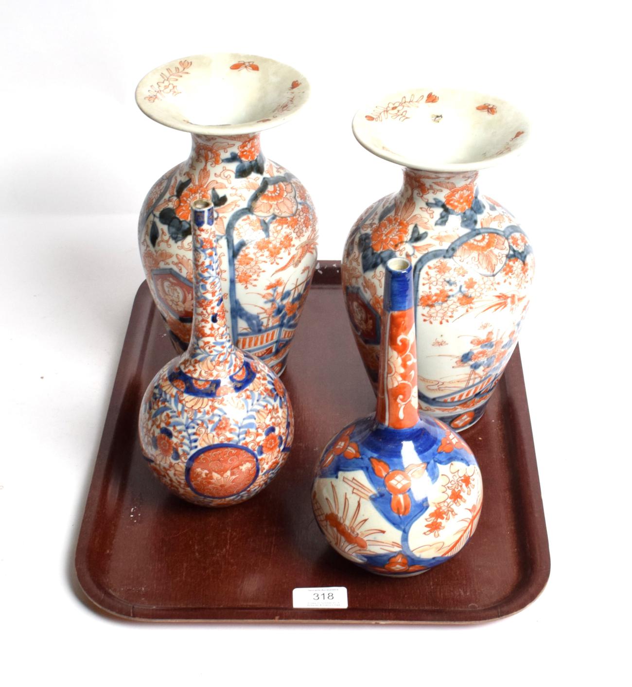 Lot 318 - A pair of Japanese Imari baluster vases, 19th century, everted rims; with two bottle vases (4)