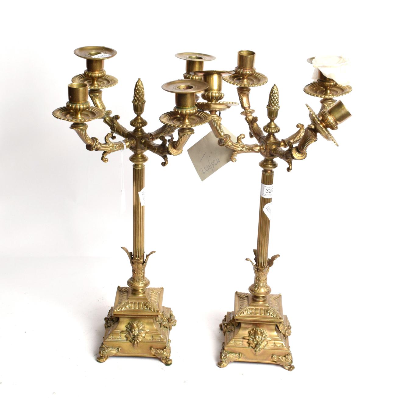 Lot 329 - A pair of Victorian brass candelabras