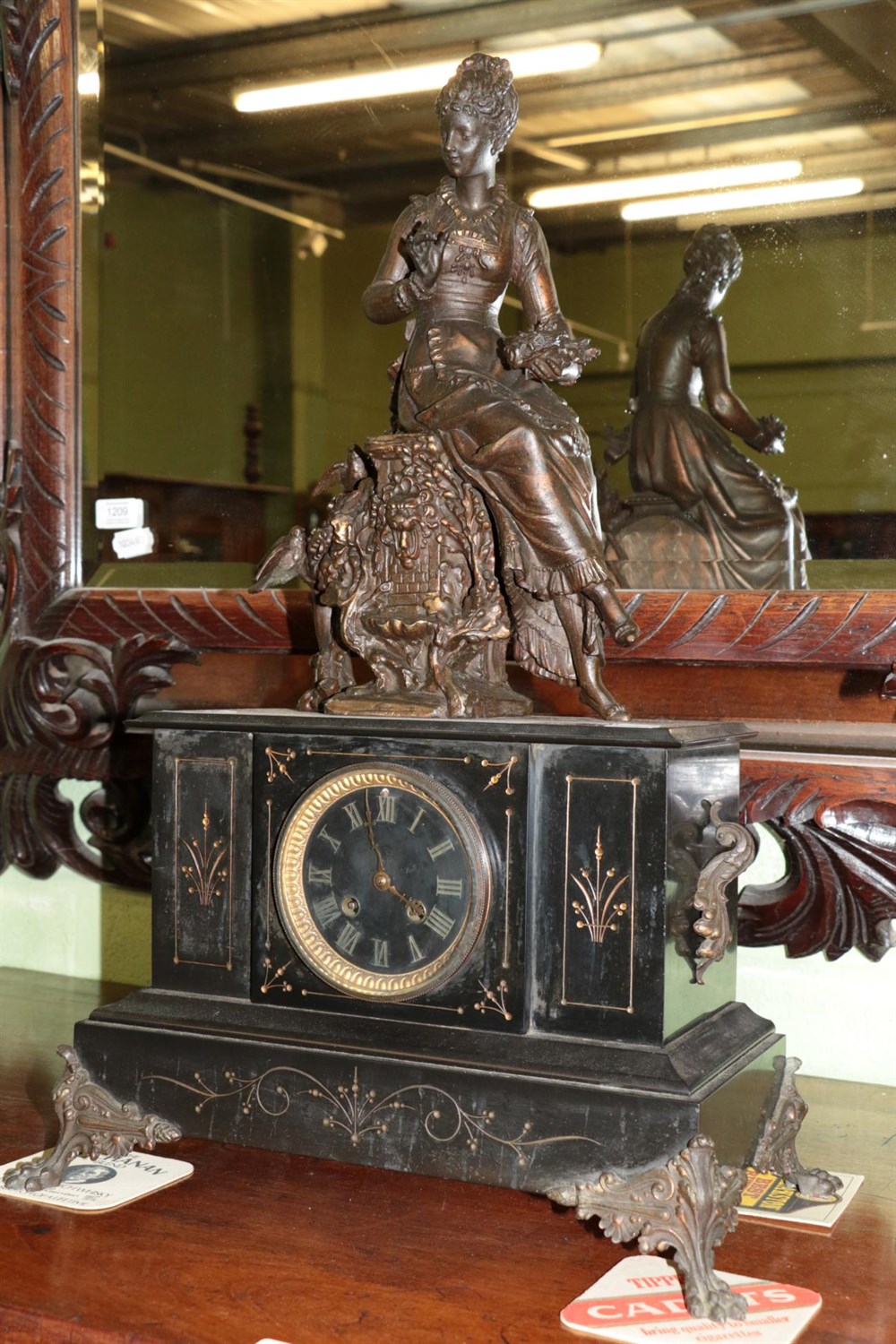 Lot 338 - A Victorian black slate striking mantel clock, case surmounted by a spelter figure of a lady