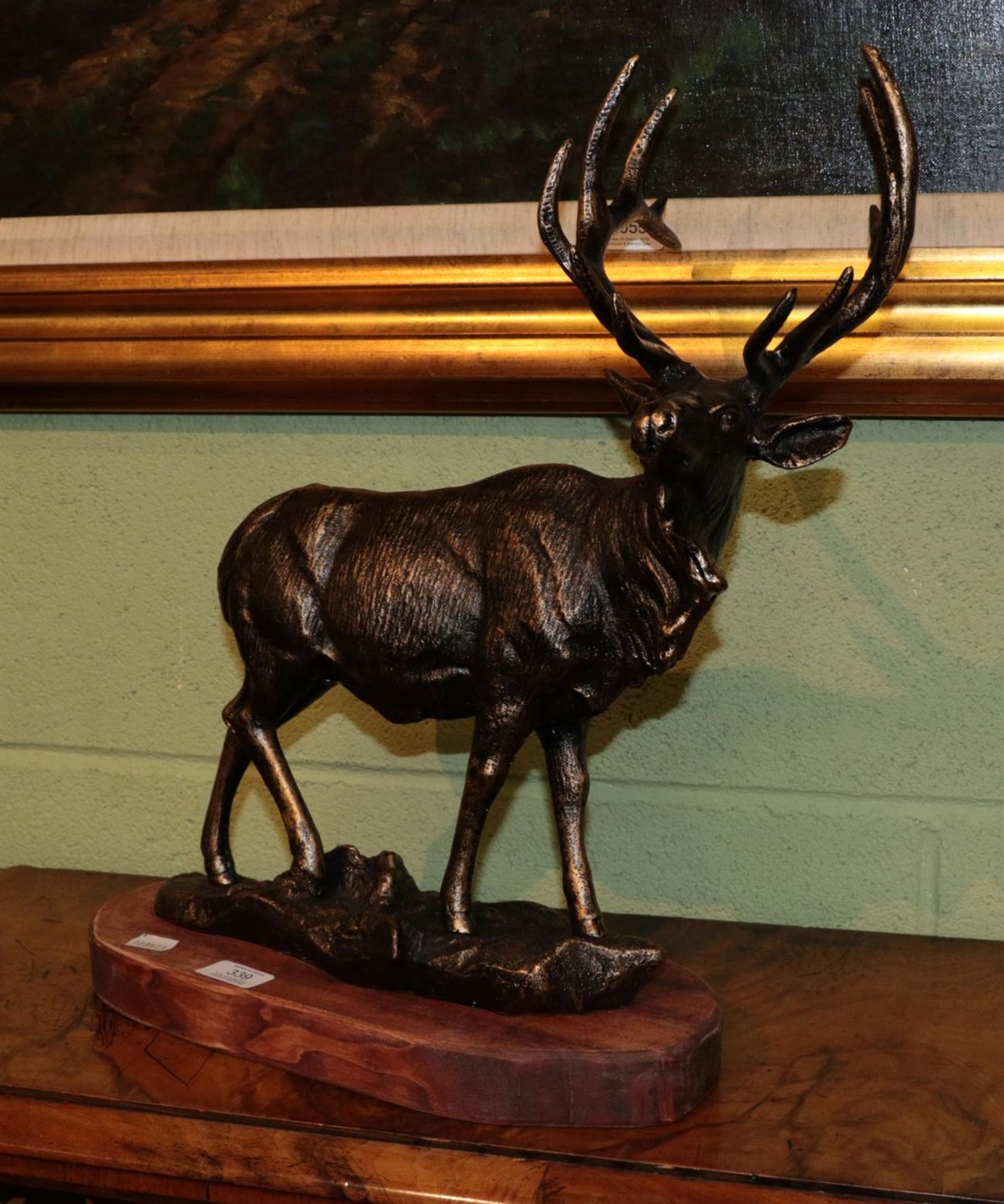 Lot 339 - A reproduction bronzed metal model of a stag