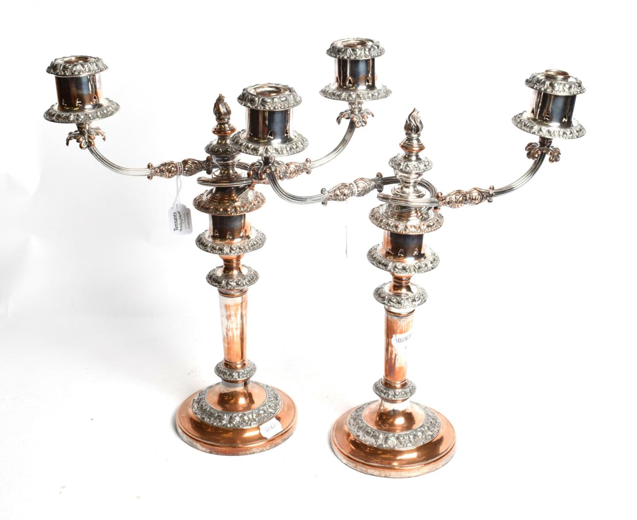 Lot 347 - A pair of silver-plated two-light candelabra, 19th century, each on circular base with foliage...