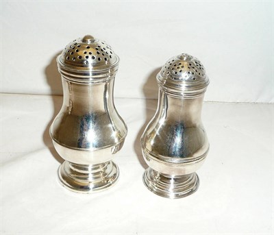 Lot 557 - Two George II Pepperettes, maker's mark worn, London 1728, each of baluster form with domed pierced