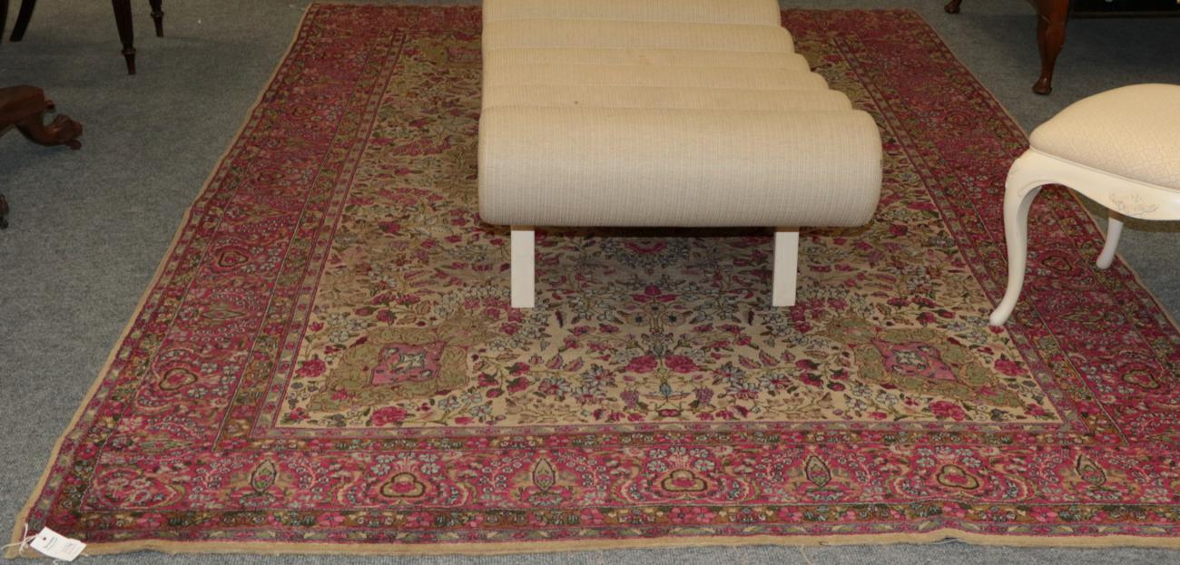 Lot 1178 - Kirman carpet, the lemon floral field with central medallion framed by candy pink borders, 314cm by