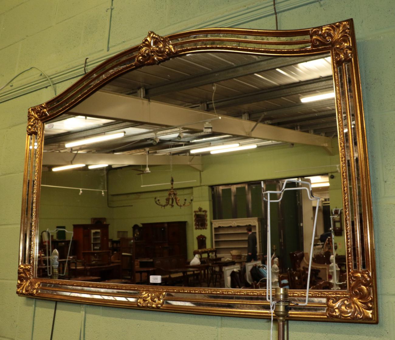 Lot 1200 A modern gilt over mantle mirror