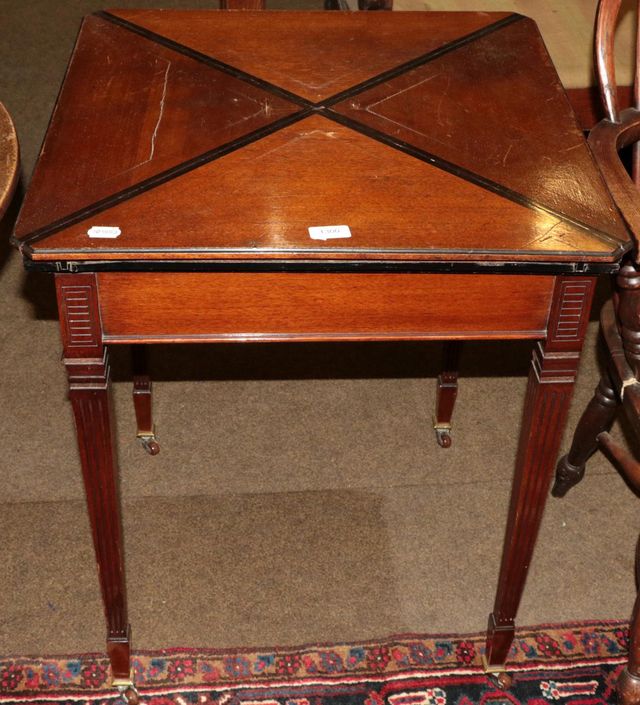 Lot 1300 - An Edwardian mahogany envelope card table