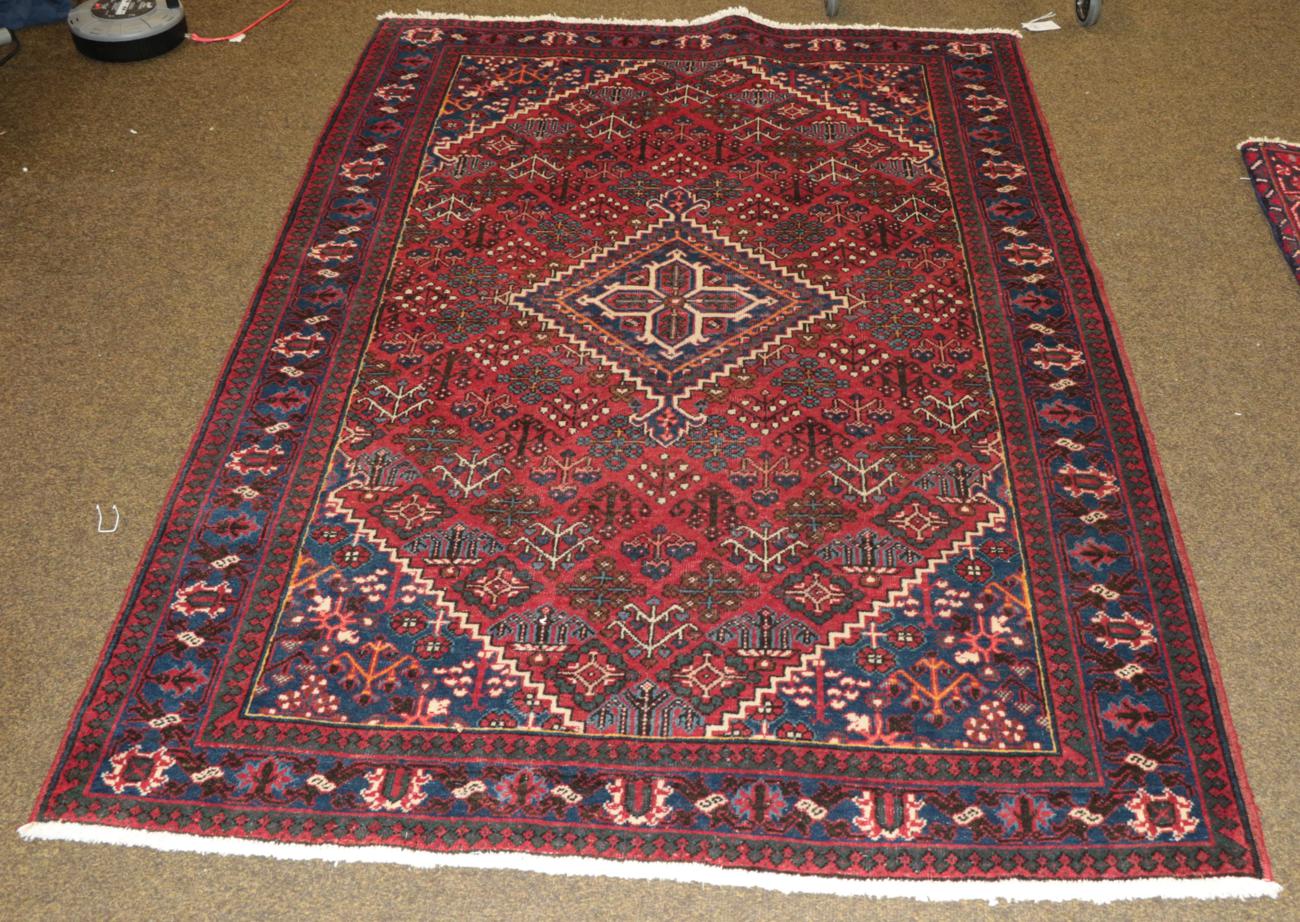 Lot 1307 - Joshaghan rug, the raspberry field of
