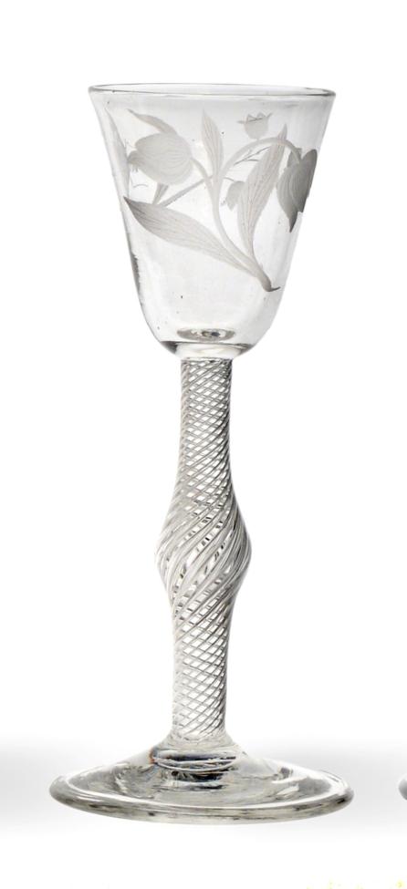 Lot 6 - A Wine Glass, circa 1750, the rounded funnel bowl engraved with tulips, lily of the valley and...