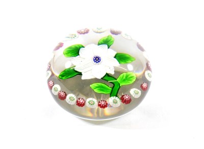 Lot 10 - A Baccarat Garlanded Double Clematis Paperweight, circa 1850, with two rows of striped white...
