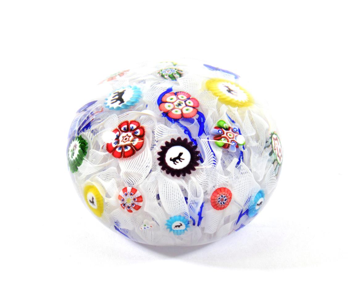 Lot 16 - A Baccarat Spaced Millefiori Paperweight, dated 1848, set with various silhouette and other...