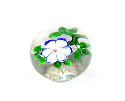 Lot 18 - A Baccarat Anemone Paperweight, circa 1850, with six blue lined white petals and green stem and...