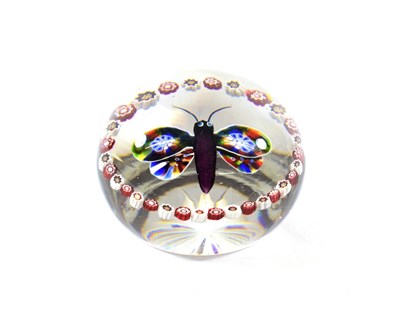 Lot 20 - A Baccarat Butterfly Paperweight, circa 1850, set with a colourful insect within a coloured garland