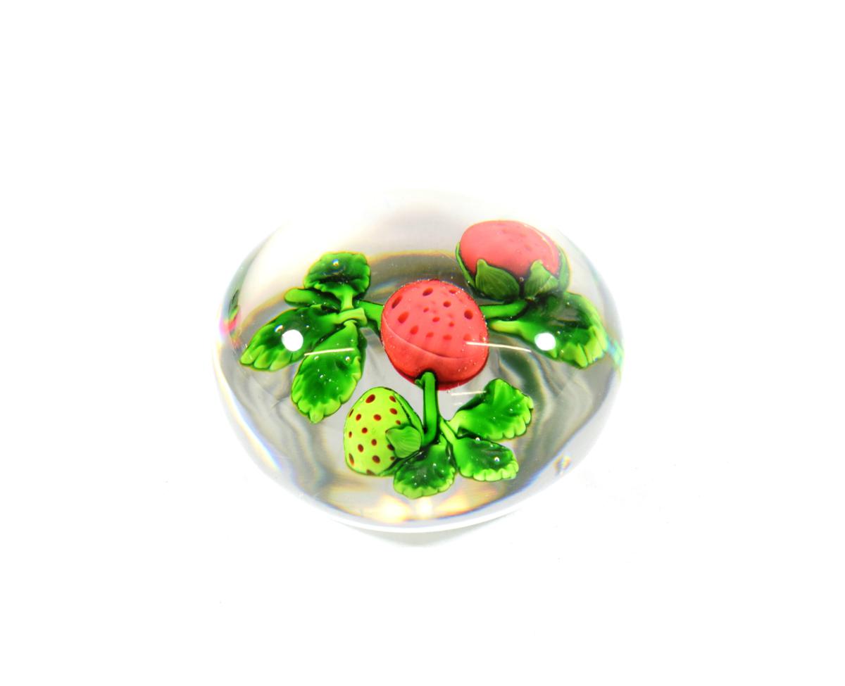 Lot 21 - A Baccarat Strawberry Paperweight, circa 1850, set with one green and two ripe berries on a...