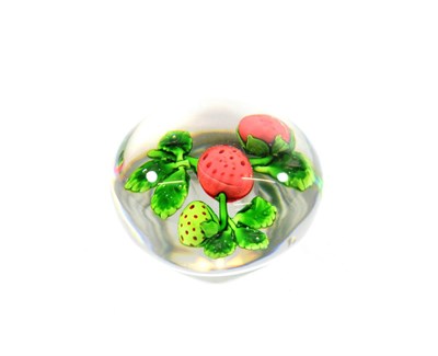 Lot 21 - A Baccarat Strawberry Paperweight, circa 1850, set with one green and two ripe berries on a...