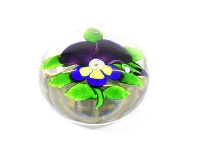 Lot 22 - A Baccarat Pansy Paperweight, circa 1850, with two purple petals and three yellow petals...