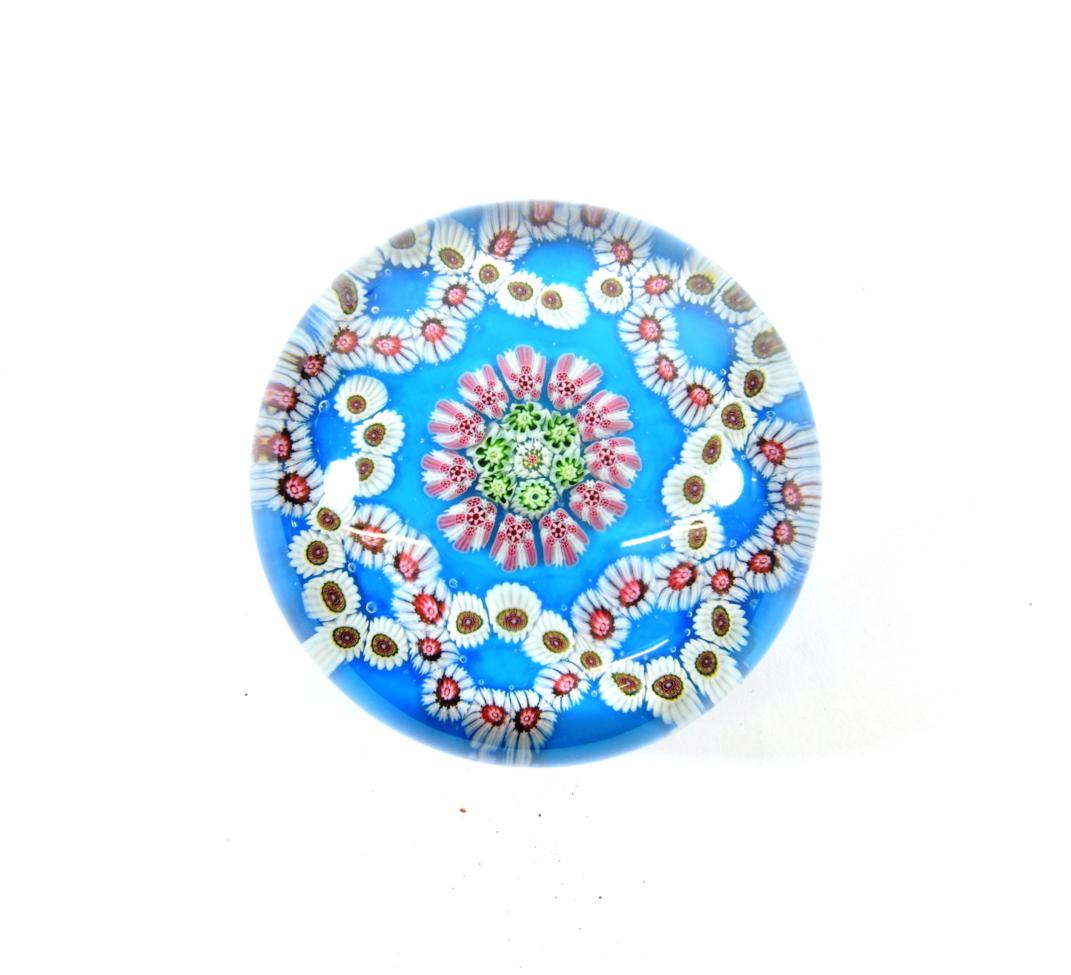 Lot 25 - A Clichy Turquoise Ground Garland Paperweight, circa 1850, set with a central roundel within...