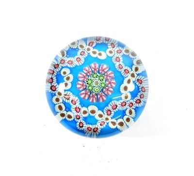 Lot 25 - A Clichy Turquoise Ground Garland Paperweight, circa 1850, set with a central roundel within...