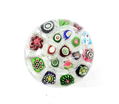Lot 26 - A Clichy Spaced Millefiori Paperweight, circa 1850, set with various coloured canes on a gauze...
