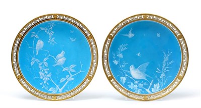 Lot 39 - A Pair of Minton Plates, circa 1870, decorated with birds amongst branches on a sky blue ground...