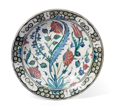 Lot 50 - An Isnik Pottery Dish, circa 1620, typically painted in blue, green, black and red bole with...