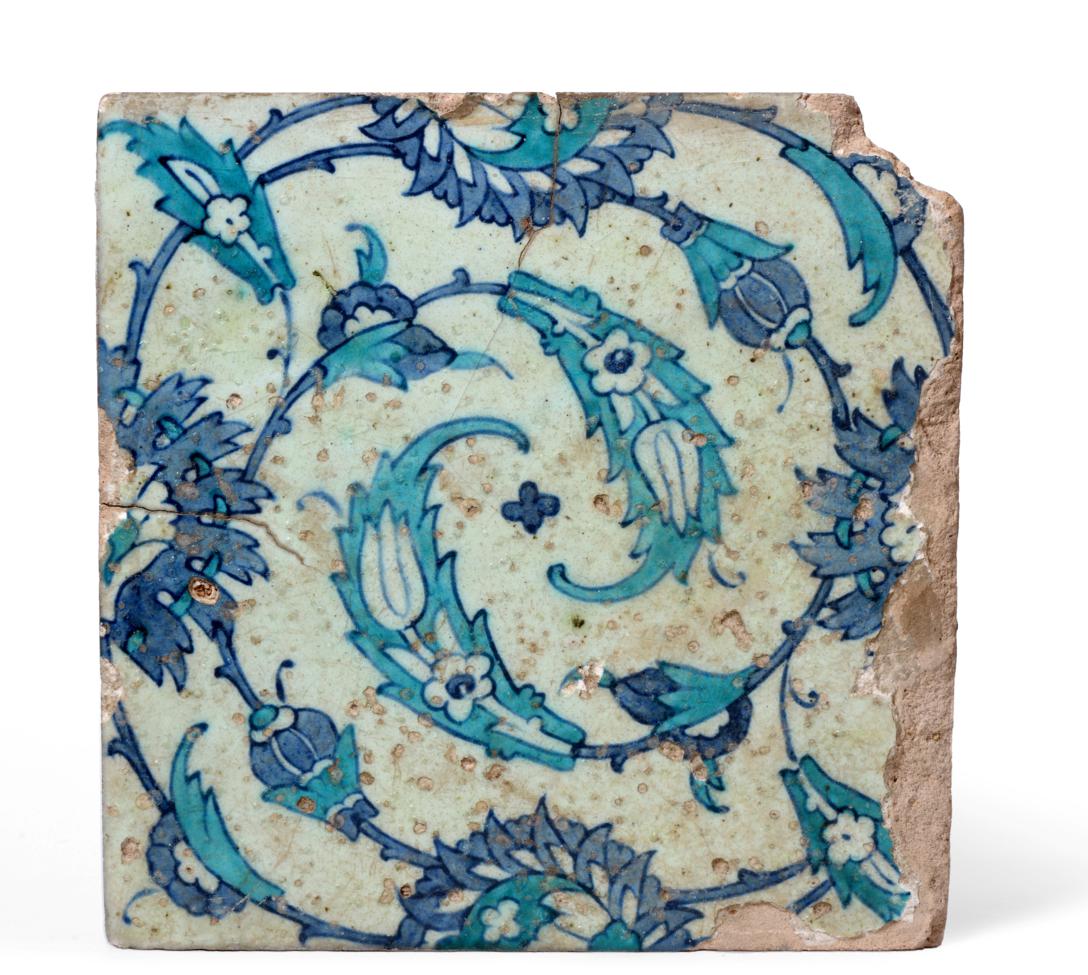 Lot 55 - A Damascus Pottery Tile, early 17th century, painted in blue and turquoise with stylised spiralling