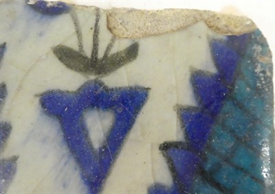 Lot 56 - A Group of Five Damascus Pottery Tile Fragments, probably 17th/18th century, painted in...