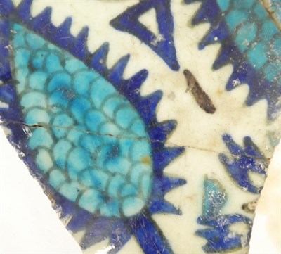 Lot 56 - A Group of Five Damascus Pottery Tile Fragments, probably 17th/18th century, painted in...