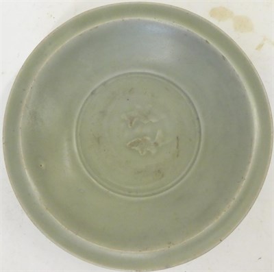 Lot 58 - A Chinese Longquan Celadon Glazed Dish, Ming Dynasty, the centre moulded with twin fish, 20cm...