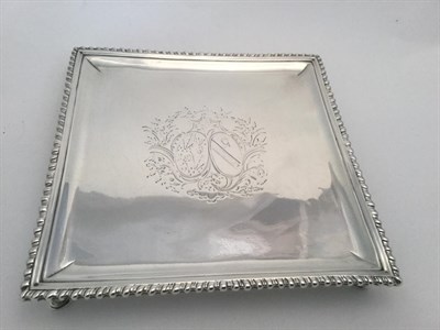 Lot 80 - A George II Silver Waiter, by Richard Rugg, London, 1765, square and with gadrooned border, on four