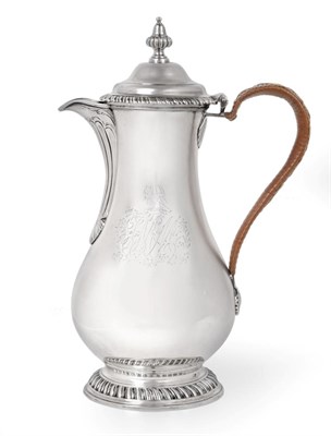 Lot 81 - A George III Silver Hot-Water Jug, by Charles Wright, London, 1768, pear-shaped and on...
