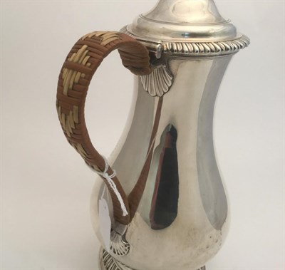 Lot 81 - A George III Silver Hot-Water Jug, by Charles Wright, London, 1768, pear-shaped and on...