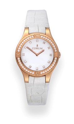 Lot 207 - A Lady's 18ct Rose Gold Diamond Set Wristwatch, signed Corum, model: Romulus, ref: 024.131.85/0009