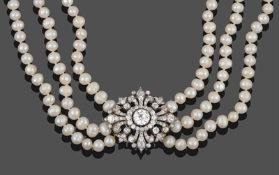 Lot 214 - A Diamond Brooch, circa 1900, with later pearl choker, the lozenge shaped diamond set brooch...